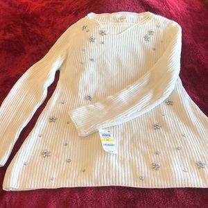 Women’s sweater with rhinestone detail.